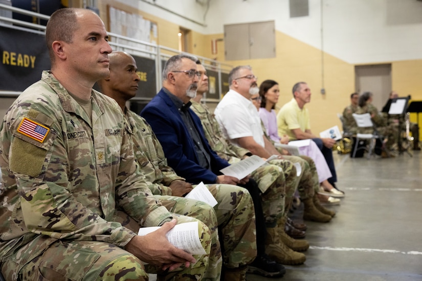 Members of the Kentucky National Guard Chaplain Corp, Kentucky Department of Military Affairs, and others listen to the history of the Kentucky National Day of Prayer event at the Wellman Armory in Frankfort, Ky. on May 1, 2025. The Kentucky National Guard held its 15th annual National Day of Prayer for service members, civilians, fallen warriors and their families at a breakfast ceremony. (U.S. Army National Guard photo by Andy Dickson)