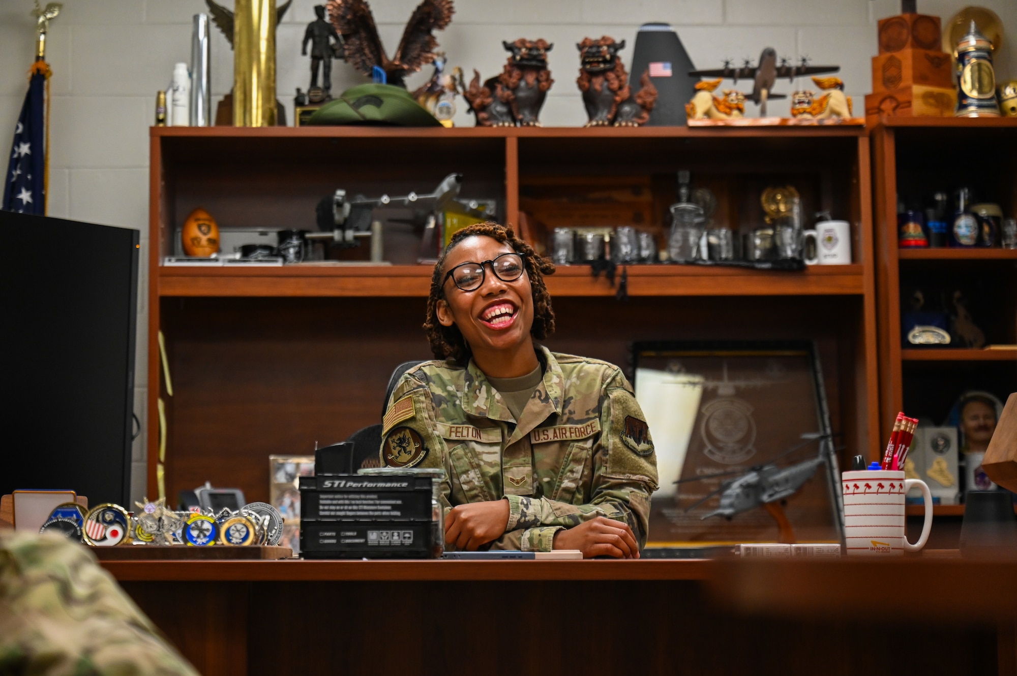 U.S. Air Force Airman First Class Geionie Felton, 388th Electronic Warfare Squadron intel mission data flight member, sits behind the wing command chief’s desk during Chief for the Day at Eglin Air Force Base, Florida, May 6, 2025. Chief for the Day offers junior enlisted members an opportunity to shadow the wing command chief and share spaces with senior leadership to highlight the mission, along with operational and strategic conversations to further their development as leaders. (U.S. Air Force photo by Capt. Benjamin Aronson)