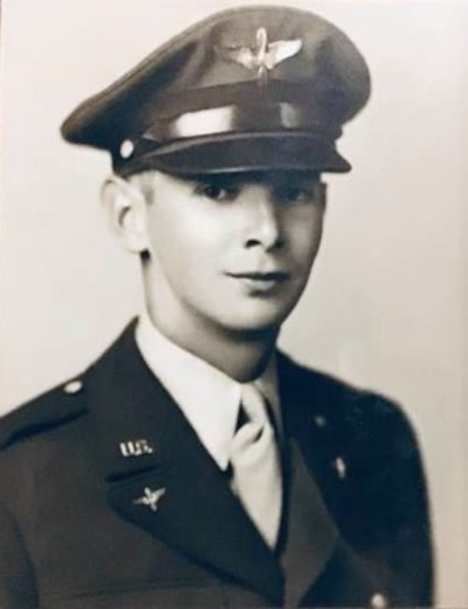 First Lieutenant Lawrence D. Damewood of the 406th Fighter Squadron, was awarded the Distinguished Flying Cross for his combat mission flown on 3 October 1944.  He is shown here in a portrait taken when he was an aviation cadet before winning his pilot wings and then his service in the 371st Fighter Group.  He continued in USAF service after the war, flying with the Skyblazers flight demonstration team in Europe in the 1950s and in the F-105 Thunderchief with the 67th Tactical Fighter Squadron during the Vietnam War.  (Courtesy Ms. Diane Damewood)