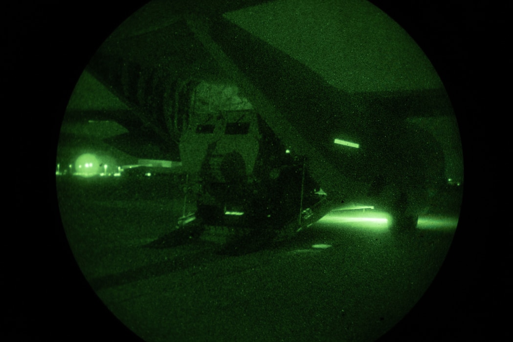 U.S. Marines with 2nd Battalion, 14th Marine Regiment, 4th Marine Division, load an M142 High Mobility Artillery Rocket System into a KC-130J Hercules during a night tactics exercise as part of Weapons and Tactics Instructor course 2-25 at Marine Corps Logistics Base Barstow, California, April 7, 2025. WTI is a seven-week training event hosted by Marine Aviation Weapons and Tactics Squadron One (MAWTS-1) which emphasizes operational integration of the six functions of Marine aviation in support of the Marine Air Ground Task Force, Joint and Coalition Forces. (U.S. Marine Corps photo by Pfc. Alexander Mantai)