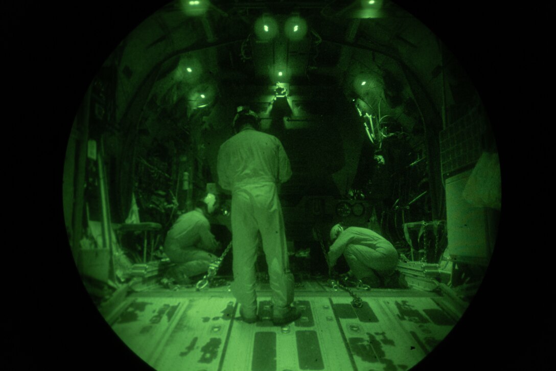 U.S. Marines assigned to Marine Aviation Weapons and Tactics Squadron One (MAWTS-1) secure an M142 High Mobility Artillery Rocket System into a KC-130J Hercules during a night tactics exercise as part of Weapons and Tactics Instructor course 2-25 at Marine Corps Logistics Base Barstow, California, April 7, 2025. WTI is a seven-week training event hosted by MAWTS-1 which emphasizes operational integration of the six functions of Marine aviation in support of the Marine Air Ground Task Force, Joint and Coalition Forces. (U.S. Marine Corps photo by Pfc. Alexander Mantai)