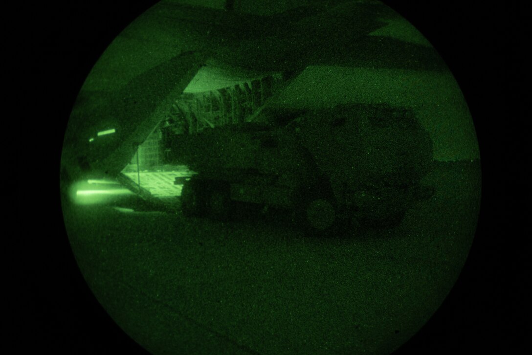 U.S. Marines with 2nd Battalion, 14th Marine Regiment, 4th Marine Division, load an M142 High Mobility Artillery Rocket System into a KC-130J Hercules during a night tactics exercise as part of Weapons and Tactics Instructor course 2-25 at Marine Corps Logistics Base Barstow, California, April 7, 2025. WTI is a seven-week training event hosted by Marine Aviation Weapons and Tactics Squadron One (MAWTS-1) which emphasizes operational integration of the six functions of Marine aviation in support of the Marine Air Ground Task Force, Joint and Coalition Forces. (U.S. Marine Corps photo by Pfc. Alexander Mantai)