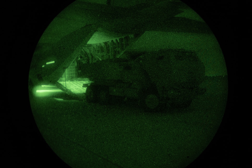 U.S. Marines with 2nd Battalion, 14th Marine Regiment, 4th Marine Division, load an M142 High Mobility Artillery Rocket System into a KC-130J Hercules during a night tactics exercise as part of Weapons and Tactics Instructor course 2-25 at Marine Corps Logistics Base Barstow, California, April 7, 2025. WTI is a seven-week training event hosted by Marine Aviation Weapons and Tactics Squadron One (MAWTS-1) which emphasizes operational integration of the six functions of Marine aviation in support of the Marine Air Ground Task Force, Joint and Coalition Forces. (U.S. Marine Corps photo by Pfc. Alexander Mantai)