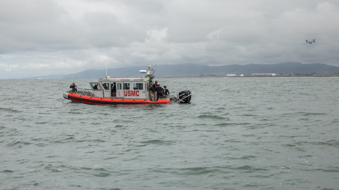 U.S. Marines with Expeditionary Operations Training Group, I Marine Expeditionary Force, stage an open-water safety craft during a maritime tactical recovery of aircraft and personnel course at Marine Corps Base Camp Pendleton, California, May 5, 2025. The Amphibious Raids Branch, EOTG, conducted the waterborne TRAP operation to develop and standardize procedures for hoist operations in a maritime environment while utilizing the MV-22 Osprey and U.S. Navy rescue swimmers. (U.S. Marine Corps photo by Lance Cpl. Jordan Searls)
