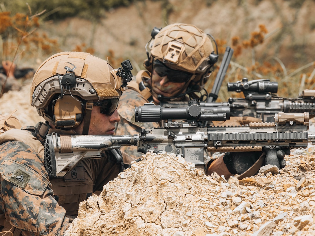 U.S. Marine Corps Cpl. Zechariah Guerrero,left, a team leader, and 1st Lt. Max C. Burke, a platoon commander, both with 2nd Battalion, 1st Marine Regiment, Marine Rotational Force – Darwin 25.3, provide security during a Maritime Key Terrain Security Operations event in support of Exercise Balikatan 25 near Puerto Princesa, Palawan, Philippines, May 5, 2025. Balikatan is a longstanding annual exercise between the U.S. and Philippine armed forces designed to strengthen the alliance, showcase the capable combined force, and demonstrate the commitment to regional security and stability. Guerrero is a native of Texas, and Burke is a native of Virginia. (U.S. Marine Corps photo by Sgt. Ezekieljay Correa)