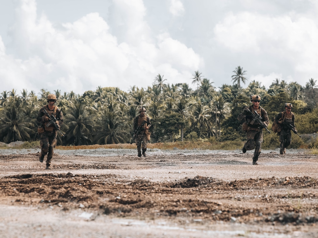 U.S. Marines with 2nd Battalion, 1st Marine Regiment, Marine Rotational Force – Darwin 25.3, run towards their objective during a Maritime Key Terrain Security Operations event in support of Exercise Balikatan 25 near Puerto Princesa, Palawan, Philippines, May 5, 2025. Balikatan is a longstanding annual exercise between the U.S. and Philippine armed forces designed to strengthen the alliance, showcase the capable combined force, and demonstrate the commitment to regional security and stability. (U.S. Marine Corps photo by Sgt. Ezekieljay Correa)
