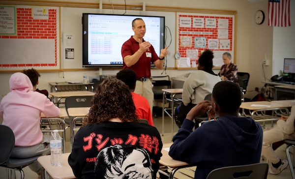 NORWICH, Conn. (May 2, 2025) Dr. John Florian, Warfighter Health and Protection Department Head at Naval Submarine Medical Research Laboratory (NSMRL), presents on his career path during the Kelly STEAM [Science, Technology, Engineering, Art, and Math] Magnet Middle School career day. Volunteers engaged with sixth, seventh, and eighth grade students, speaking on the impacts that Navy Medicine has on force health and readiness. Community events such as career days expose students to career paths they otherwise may not know about, sparking interest in medicine and STEM careers. NSMRL, part of Navy Medicine Research & Development and based out of Groton, Connecticut, sustains the readiness and superiority of U.S. undersea warfighters through innovative health and performance research and works to lead the world in delivering science solutions to ensure undersea warrior dominance. For 250 years, Navy Medicine, represented by more than 44,000 highly-trained military and civilian healthcare professionals, has delivered quality healthcare and enduring expeditionary medical support to the warfighter on, below, and above the sea and ashore. (U.S. Navy photo by Emily Swedlund/released)