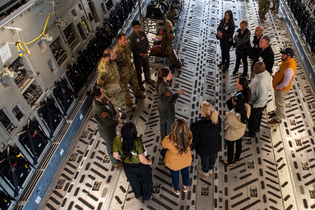 Airman gives tour to honorary commander on C-17