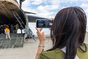 Honorary commander takes photo of C-5 on the flight line