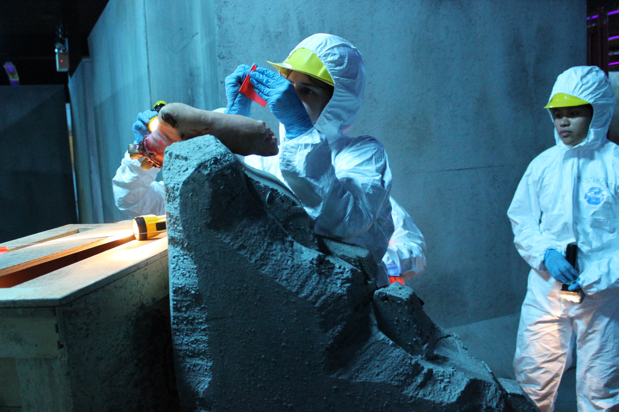 U.S. Senior Airmen Brianna Guerra, 42nd Force Support Squadron customer technician and Airmen 1st Class Mary Banzon, 42nd FSS career development technician, tag a artificial foot during a site recovery sweep in a simulated tornado disaster at the “The Last Stand” Laser Tag Facility, Gunter-Maxwell Annex, Alabama, Mach 28, 2025.