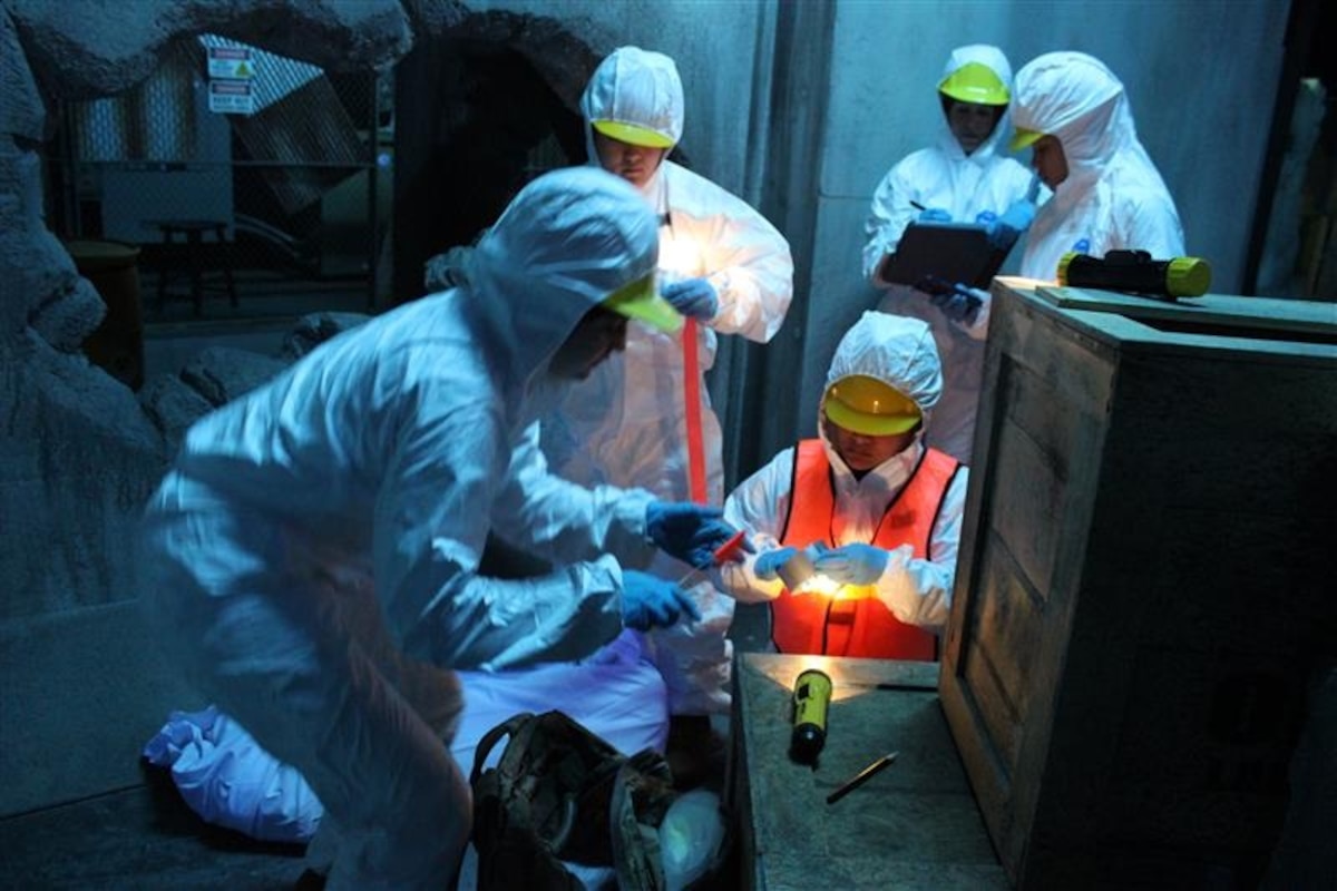 U.S. Airmen from the 42nd Force Support Squadron, label and bag an item during a personnel recovery in a simulated tornado disaster at the “The Last Stand” Laser Tag