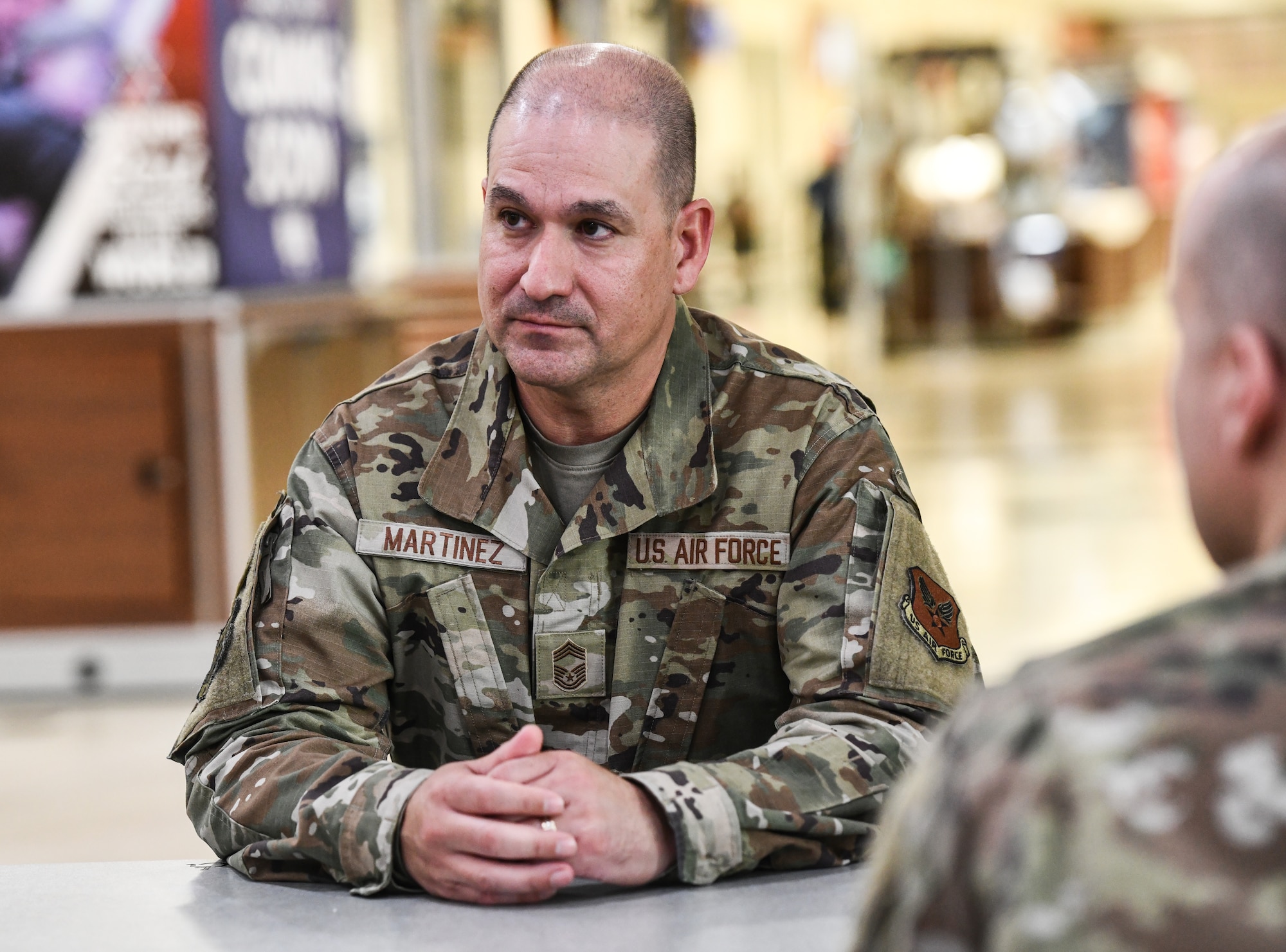 Col. Aaron Gray, 55th Wing deputy commander, greets Chief Master Sgt. Richard Martinez, Army and Air Force Exchange Service senior enlisted advisor, meets with Col. Aaron Gray, 55th Wing deputy commander, at the Offutt Air Force Base Base Exchange, May 7, 2025. Chief Martinez was visiting as part of a tour looking to make quality-of-life improvements for Airmen on various installations. (U.S. Air Force photo by Chad Watkins)
