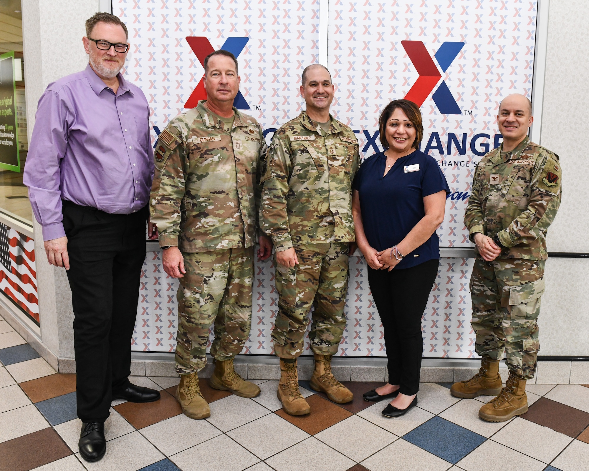 Scott Bonner,  Army and Air Force Exchange Service  regional vice president, mid central region, Chief Master Sgt. Adam Clingan, 55th Mission Support Group senior enlisted leader, Chief Master Sgt. Richard Martinez, Army and Air Force Exchange Service senior enlisted advisor, Alison Greene-Ortiz, Army and Air Force Exchange Service, Offutt AFB general manager, and Col. Aaron Gray, 55th Wing deputy commander, pose for a photo at the Offutt Air Force Base Base Exchange, May 7, 2025. Chief Martinez was visiting as part of a tour looking to make quality-of-life improvements for Airmen on various installations. (U.S. Air Force photo by Chad Watkins)