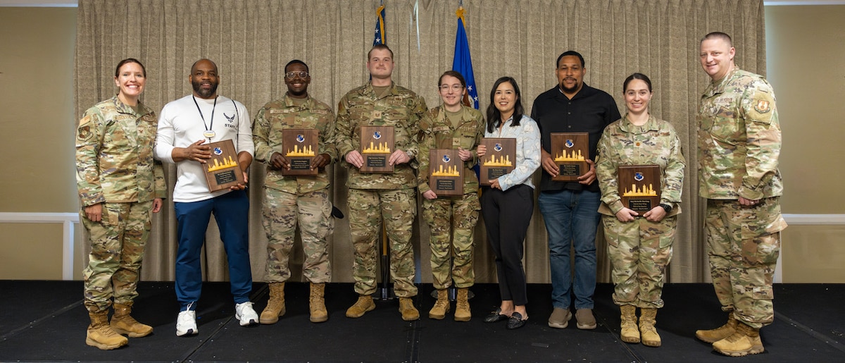 Commanders presenting awards to awardees.