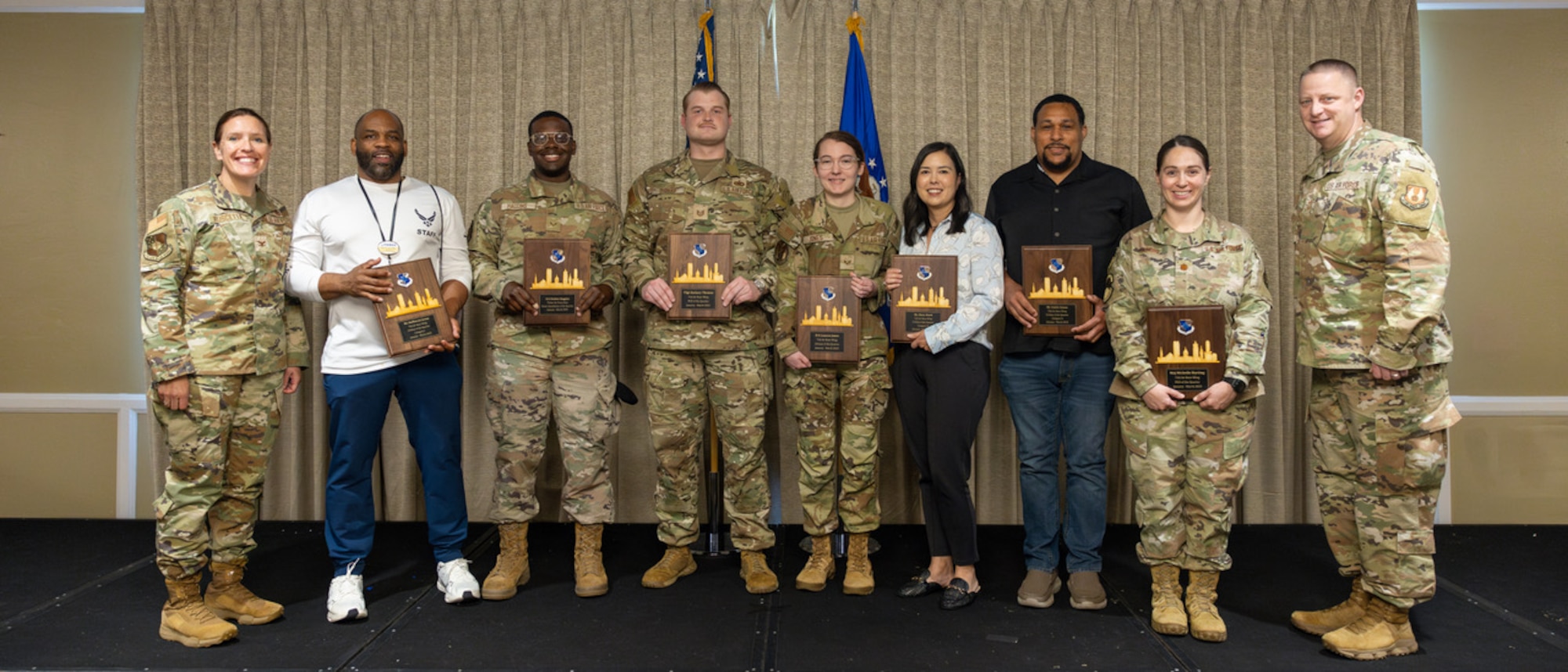 Commanders presenting awards to awardees.
