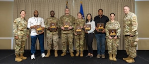 Commanders presenting awards to awardees.