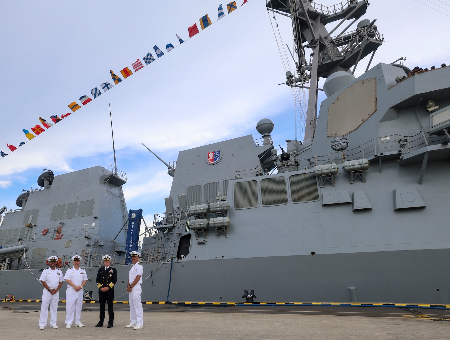 CHANGI NAVAL BASE, SINGAPORE (May 6, 2025) Adm. Steve Koehler, commander, U.S. Pacific Fleet, center right, Capt. David Huljack, commander of Destroyer Squadron 15, right, Cmdr. Ivan Dobrev, commanding officer of the Arleigh Burke-class guided-missile destroyer USS Dewey (DDG 105), center left, and Cmdr. Jordan White, executive officer of DDG 105, left, pose for a photo on Changi Naval Base during the International Maritime Defense Exhibition (IMDEX) Asia 25, May 6, 2025. IMDEX Asia 25 is Asia's leading naval and maritime defense event. The U.S. Navy routinely participates in IMDEX to promote dialogue, stability, and security cooperation throughout the Indo-Pacific. (U.S. Navy photo by Mass Communication Specialist 1st Class Devin Monroe)