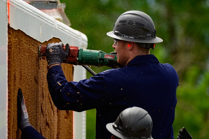 Ethan Cash, Missile Mishap Recovery Team, cuts an access area during a training event in Ogden, Utah, May 5, 2025. With exception to the warhead, the MMRT responds to Minuteman III situations that fall out of the scope of tech data and standard procedures or pose significant hazards. The highly specialized team is the only one in the Air Force. (U.S. Air Force photo by R. Nial Bradshaw)