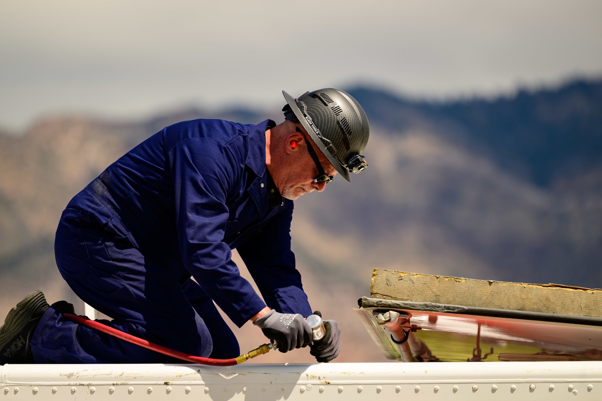 James Duff, Missile Mishap Recovery Team, cuts an access area during a training event in Ogden, Utah, May 5, 2025. With exception to the warhead, the MMRT responds to Minuteman III situations that fall out of the scope of tech data and standard procedures or pose significant hazards. The highly specialized team is the only one in the Air Force. (U.S. Air Force photo by R. Nial Bradshaw)