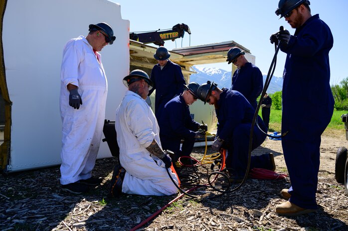 Members of the Missile Mishap Recovery Team prepare equipment during a training event in Ogden, Utah, May 5, 2025. With exception to the warhead, the MMRT responds to Minuteman III situations that fall out of the scope of tech data and standard procedures or pose significant hazards. The highly specialized team is the only one in the Air Force. (U.S. Air Force photo by R. Nial Bradshaw)