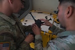 U.S. Army Soldiers holding a drone.