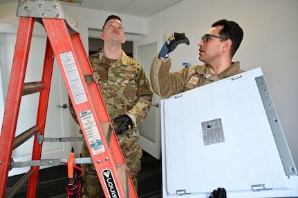 Members of the D.C. Air National Guard’s 113th Wing Civil Engineer Squadron (CES) conduct HVAC diagnostics and repair, LED lighting installation, plumbing fixture placement, and electrical rewiring at the Capital Guardian Youth ChalleNGe Academy (CGYCA), in Laurel, MD, on April 12, 2025. The hands-on April 7-19 project not only offered vital Administrative Building upgrades, but also skills development. Civil engineers maintain the infrastructure for military operations ensuring they’re functional, relevant, efficient, and resilient in various operational environments.