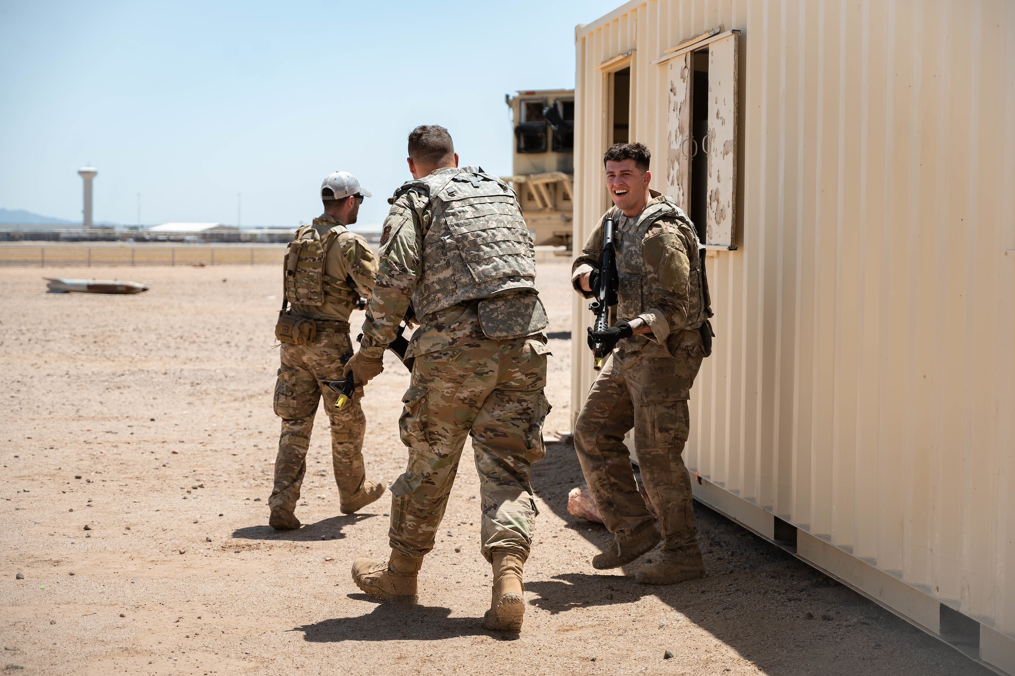 From left, U.S. Air Force Senior Airmen Jessey Mclain, Logan Ellett, and Ethan Jacobs, 56th Fighter Wing Airman Leadership School students, prepare to clear a building