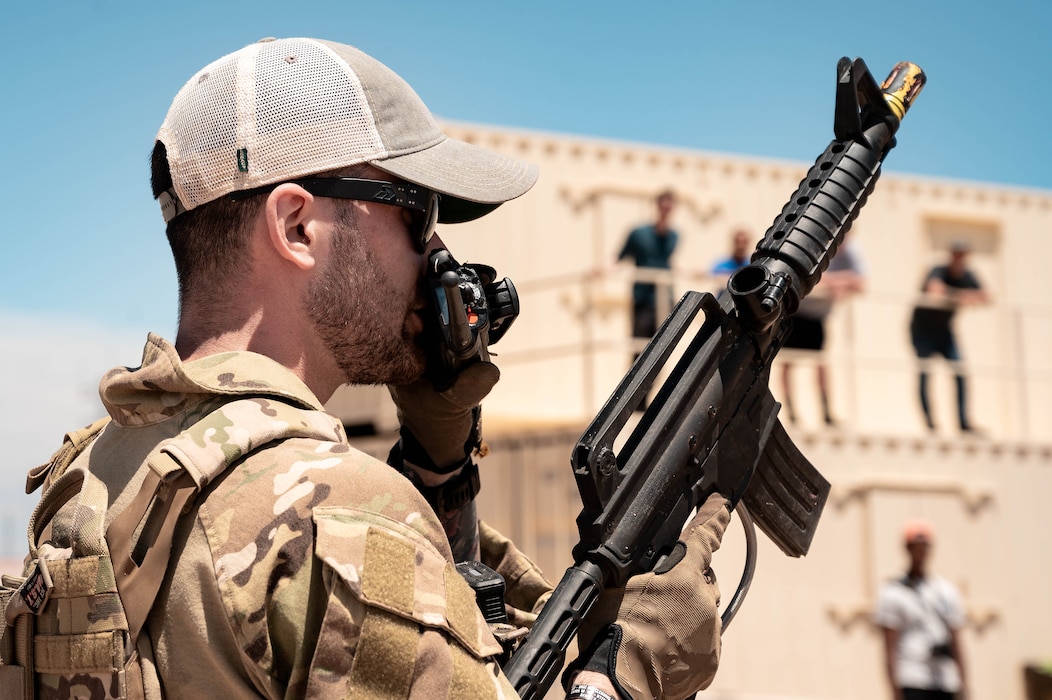 U.S. Air Force Senior Airman Jessey Mclain, 56th Civil Engineer Squadron explosive ordnance technician, communicates via radio