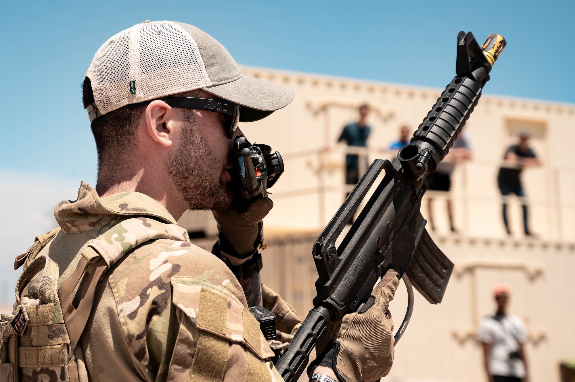 U.S. Air Force Senior Airman Jessey Mclain, 56th Civil Engineer Squadron explosive ordnance technician, communicates via radio
