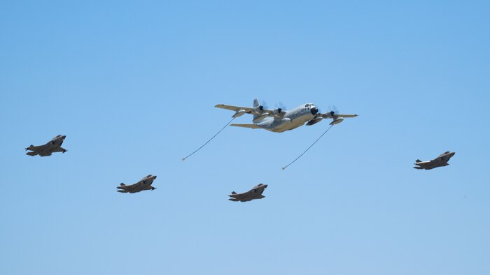 military aircraft fly in formation