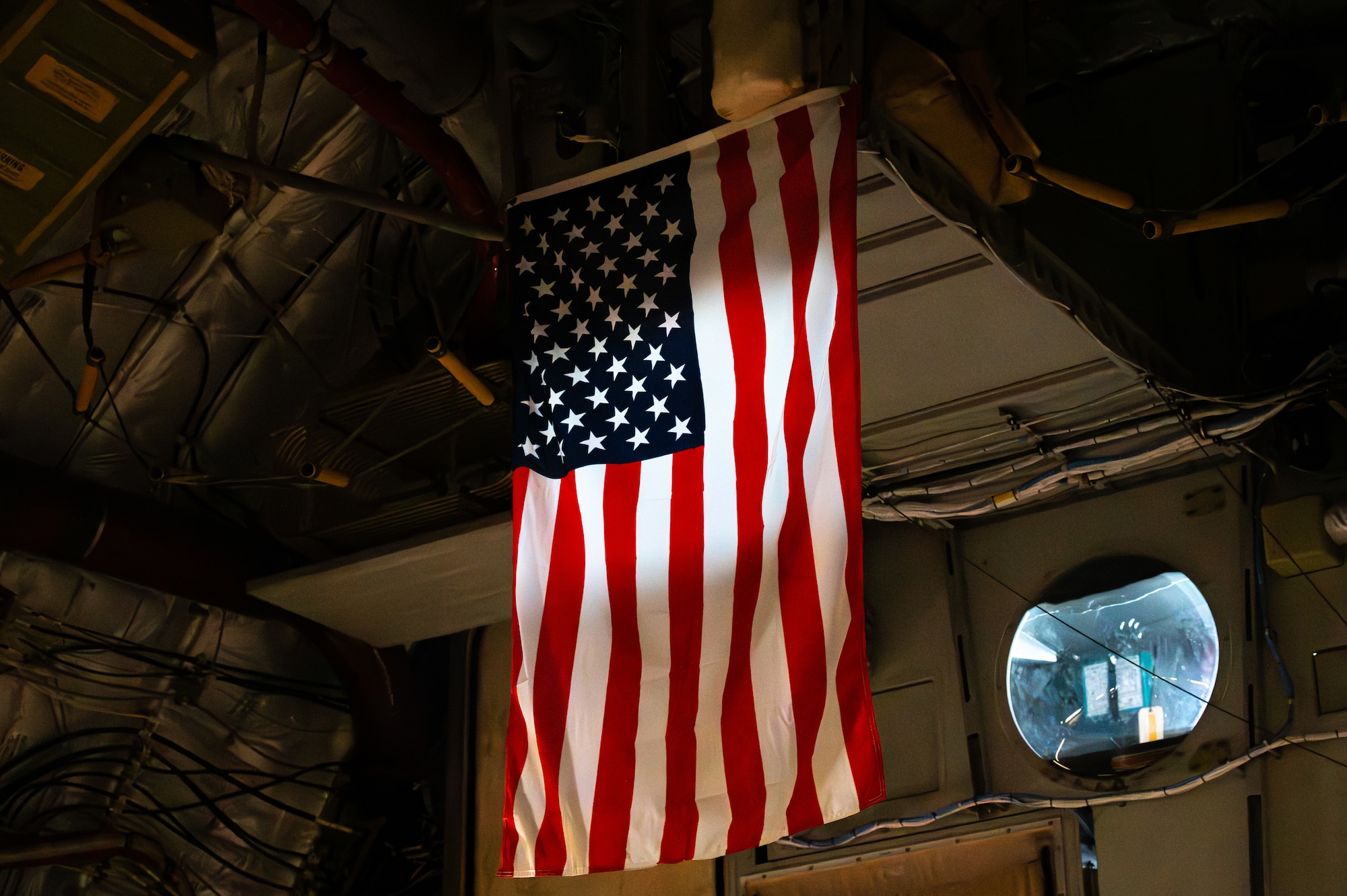 A U.S. Flag hangs inside a C-17 Globemaster III.