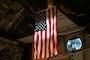 A U.S. Flag hangs inside a C-17 Globemaster III.