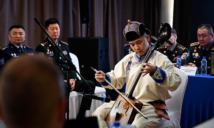 A Mongolian musician performs on the morin khuur, a traditional two-stringed instrument adorned with a horse head, during the Pacific Airlift Rally 25 opening ceremony in Ulaanbaatar, Mongolia, May 5, 2025.