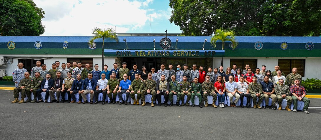 Armed Forces of the Philippines, U.S. Marines, and Japan Self-Defense Forces service members and U.S. government officials pose for a group photo during a Humanitarian Assistance and Disaster Relief Tabletop Exercise in support of Exercise Balikatan 25 at Camp Aguinaldo, Manila, Philippines, May 1, 2025. Balikatan is a longstanding annual exercise between the Armed Forces of the Philippines and the U.S. military designed to strengthen our ironclad alliance, improve our capable combined force and demonstrate our commitment to regional security and stability. (U.S. Air Force photo by Airman 1st Class Carson Jeney)