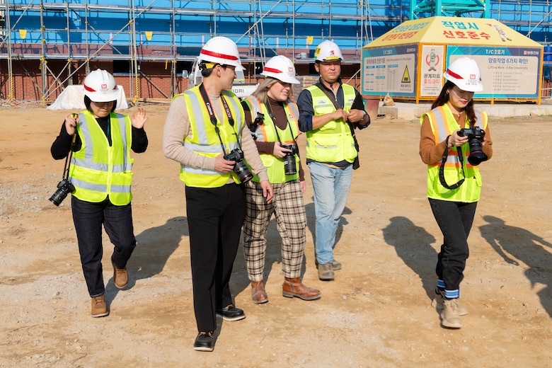 Rachel Napolitan with her team and FED visual information employee at a project site.