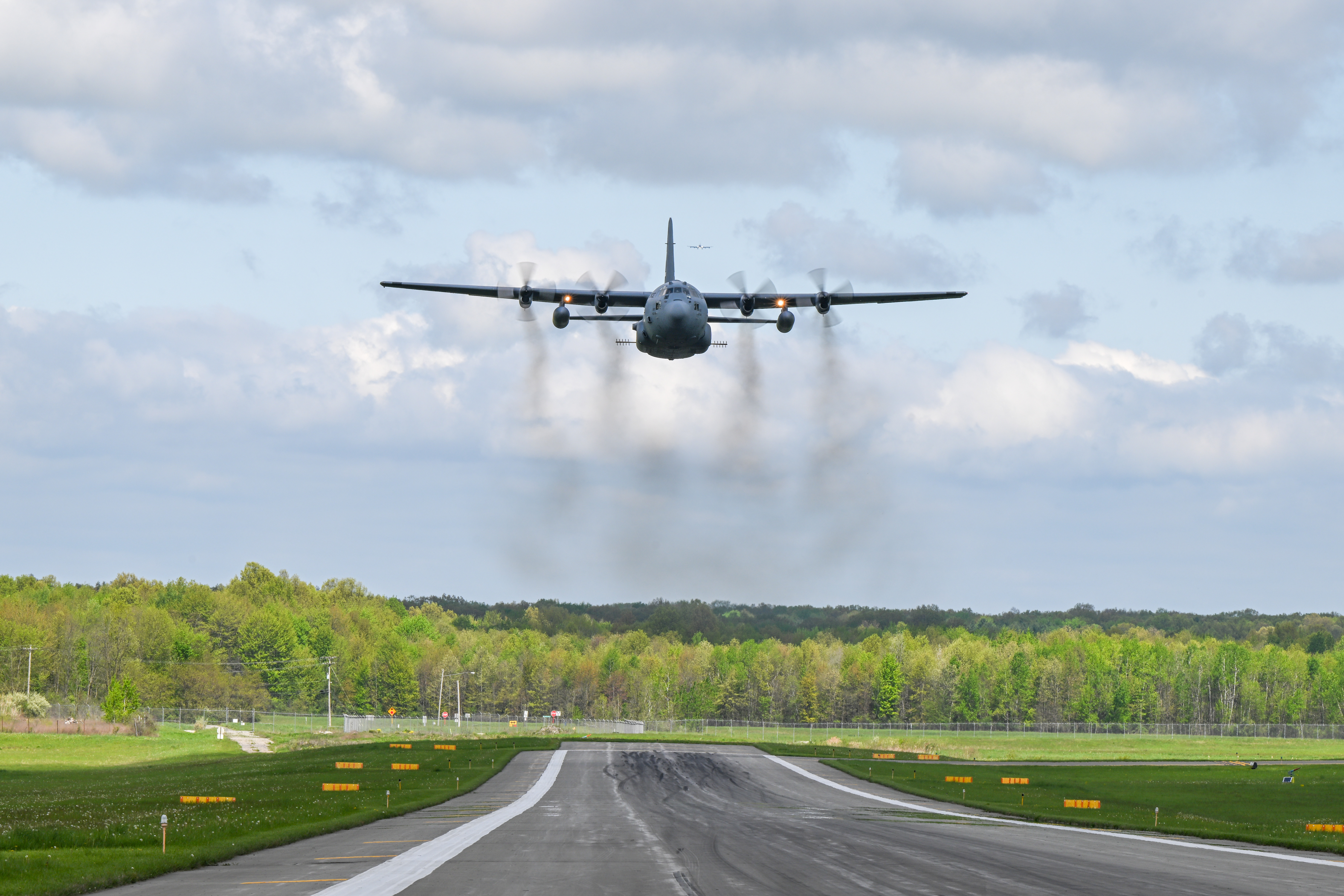 A 910th Airlift Wing C-130H Hercules aircraft, equipped with a training-only modular aerial spray system, flies near Youngstown Air Reserve Station, Ohio, May 7, 2025. The aircraft performed a larvicide application demonstration, using water, for a group of pest management specialists from across the Department of Defense attending an aerial spray application course.