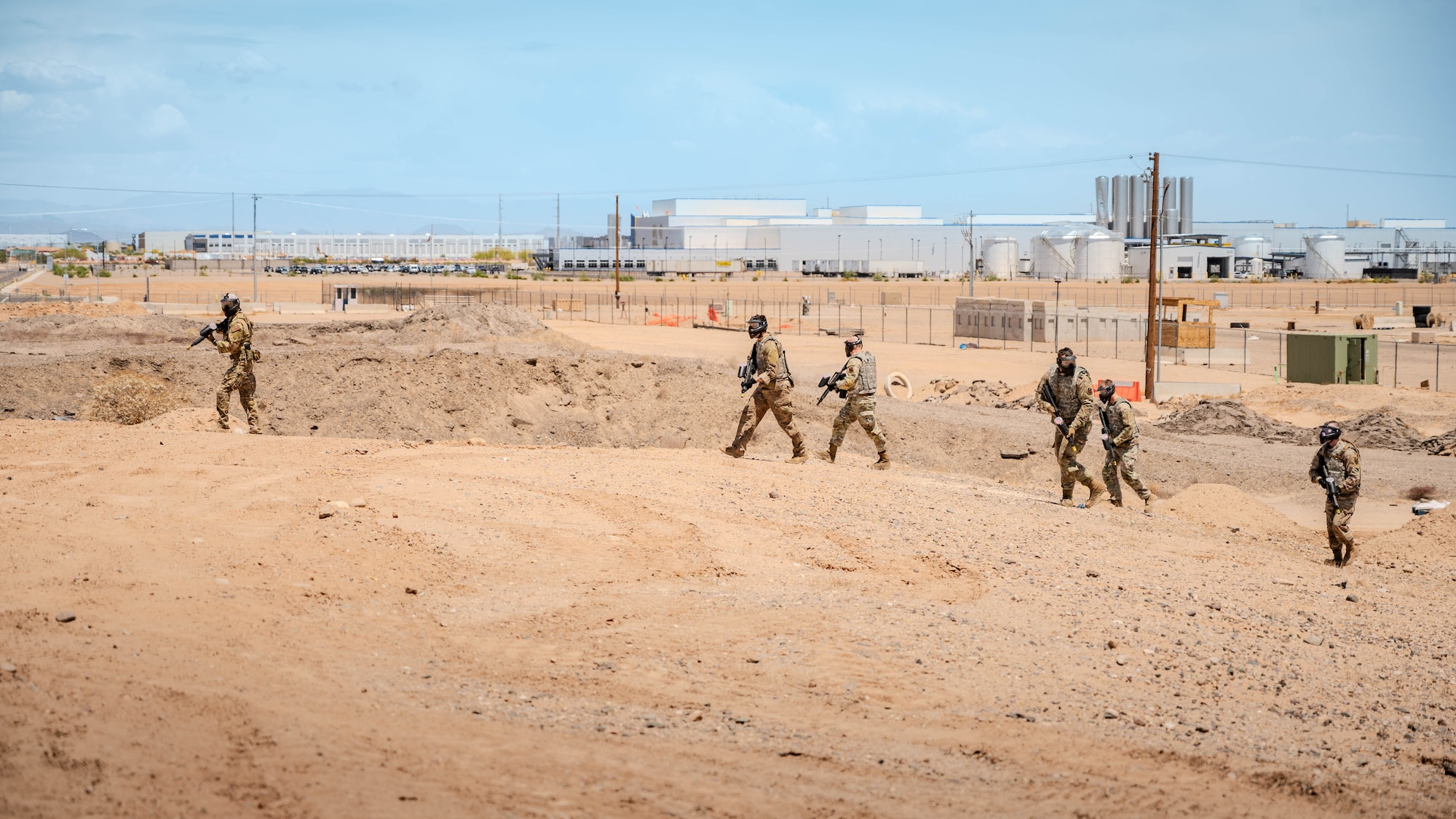U.S. Air Force Airmen attending the John. J Rhoades Airman Leadership School conduct a team sweep of an area with simulated armed threats