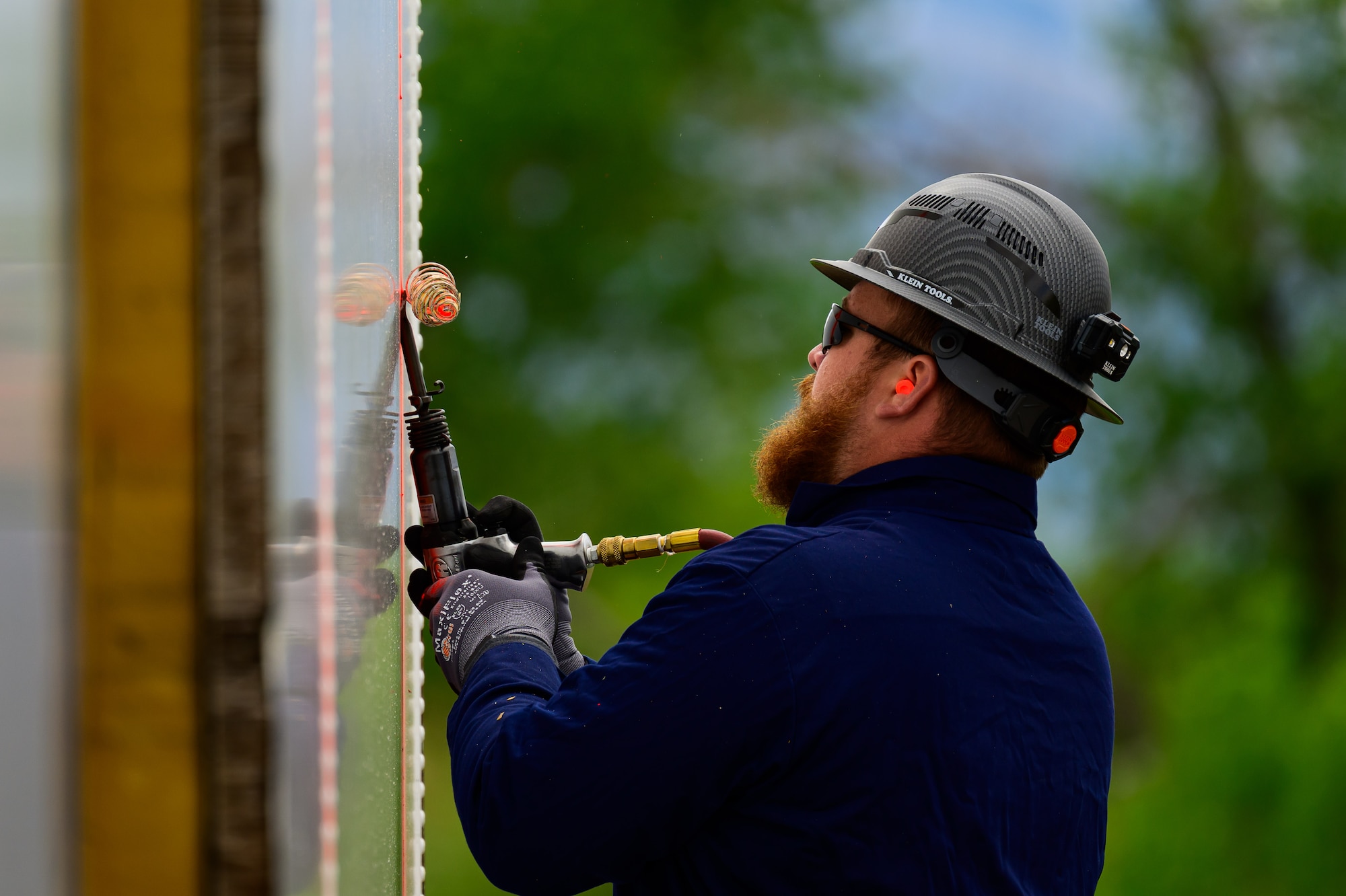 Kolton Ollis, Missile Mishap Recovery Team, cuts an access area during a training event in Ogden, Utah, May 5, 2025. With exception to the warhead, the MMRT responds to Minuteman III situations that fall out of the scope of tech data and standard procedures or pose significant hazards. The highly specialized team is the only one in the Air Force. (U.S. Air Force photo by R. Nial Bradshaw)