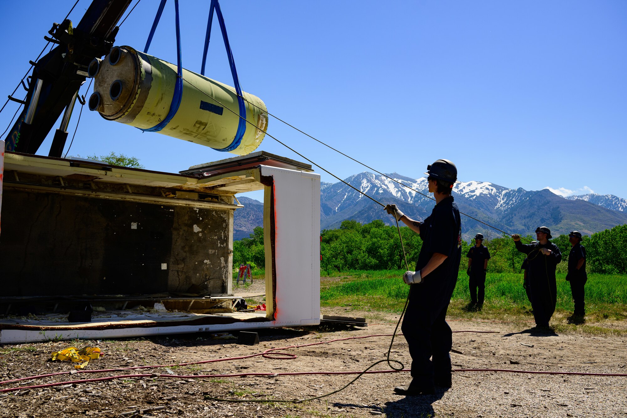 Members of the Missile Mishap Recovery Team lift a Minuteman III motor during a training event in Ogden, Utah, May 5, 2025. With exception to the warhead, the MMRT responds to Minuteman III situations that fall out of the scope of tech data and standard procedures or pose significant hazards. The highly specialized team is the only one in the Air Force. (U.S. Air Force photo by R. Nial Bradshaw)
