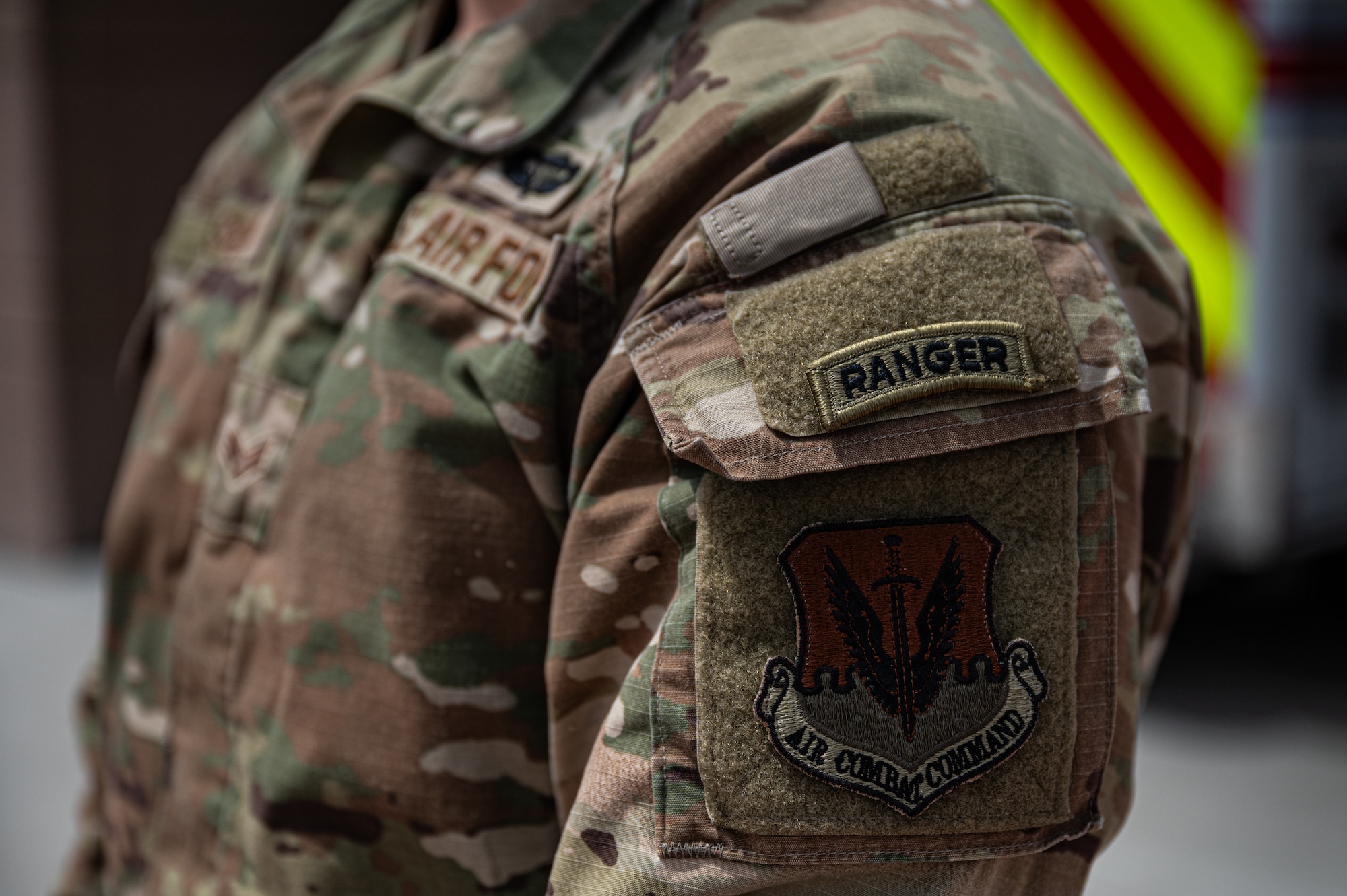 Ranger patch on Airmen's arm.