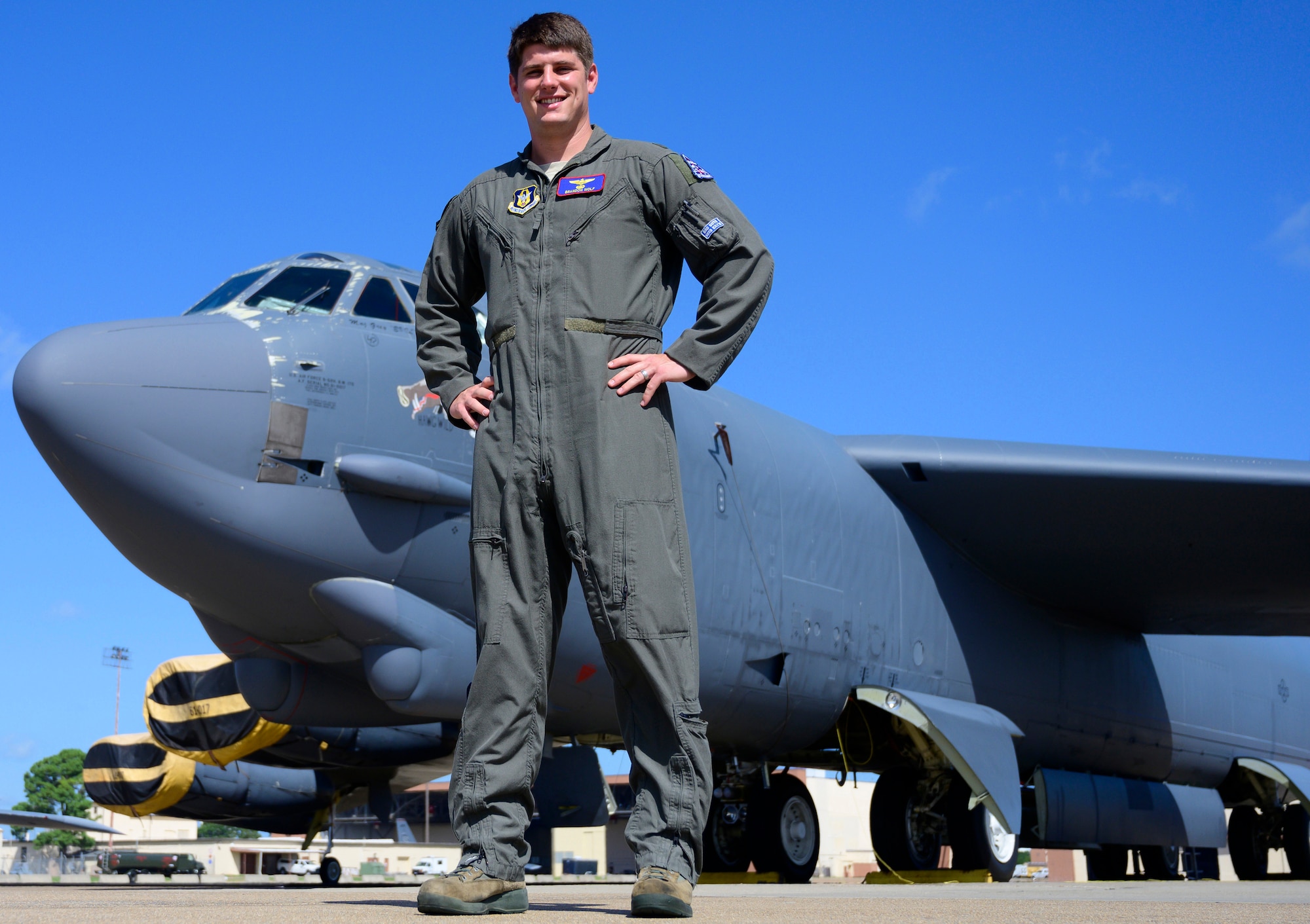 Airman stands outside a B-52
