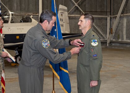 Former 487th TRS commander receives Meritorious Service Medal