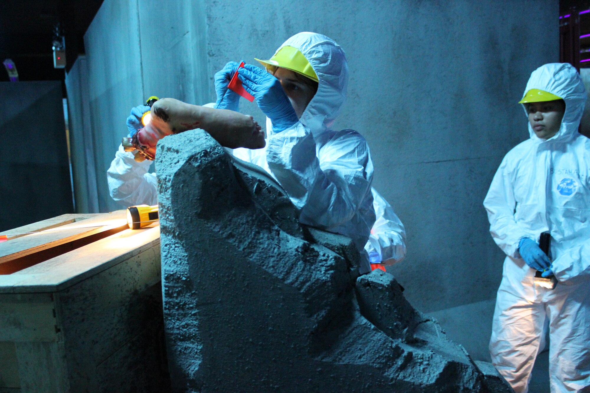 U.S. Senior Airmen Brianna Guerra, 42nd Force Support Squadron customer technician and Airmen 1st Class Mary Banzon, 42nd FSS career development technician, tag a artificial foot during a site recovery sweep in a simulated tornado disaster at the “The Last Stand” Laser Tag Facility, Gunter-Maxwell Annex, Alabama, Mach 28, 2025.