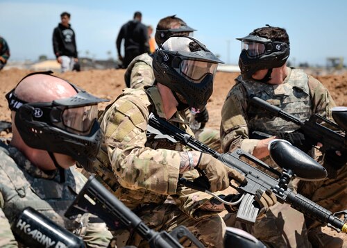 U.S. Air Force Airmen attending the John. J Rhoades Airman Leadership School plan their next moves in an area active with armed enemies