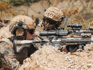 U.S. Marine Corps Cpl. Zechariah Guerrero,left, a team leader, and 1st Lt. Max C. Burke, a platoon commander, both with 2nd Battalion, 1st Marine Regiment, Marine Rotational Force – Darwin 25.3, provide security during a Maritime Key Terrain Security Operations event in support of Exercise Balikatan 25 near Puerto Princesa, Palawan, Philippines, May 5, 2025. Balikatan is a longstanding annual exercise between the U.S. and Philippine armed forces designed to strengthen the alliance, showcase the capable combined force, and demonstrate the commitment to regional security and stability. Guerrero is a native of Texas, and Burke is a native of Virginia. (U.S. Marine Corps photo by Sgt. Ezekieljay Correa)