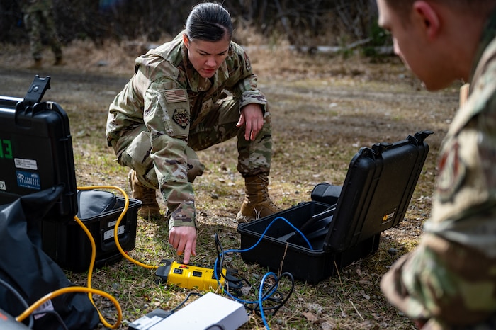 U.S. Air Force Master Sgt. Casey Heinz, a first sergeant assigned to the 354th Operations Support Squadron from Eielson Air Force Base, Alaska, sets up communications equipment at Camp Madbull during the first-ever Pacific Air Forces First Sergeant Readiness Summit at Joint Base Elmendorf-Richardson, Alaska, May 6. The summit brought more than 100 first sergeants from various major commands to put first sergeant responsibilities into action and improve their combat readiness. (U.S. Air Force photo by Airman 1st Class Hunter Hites)