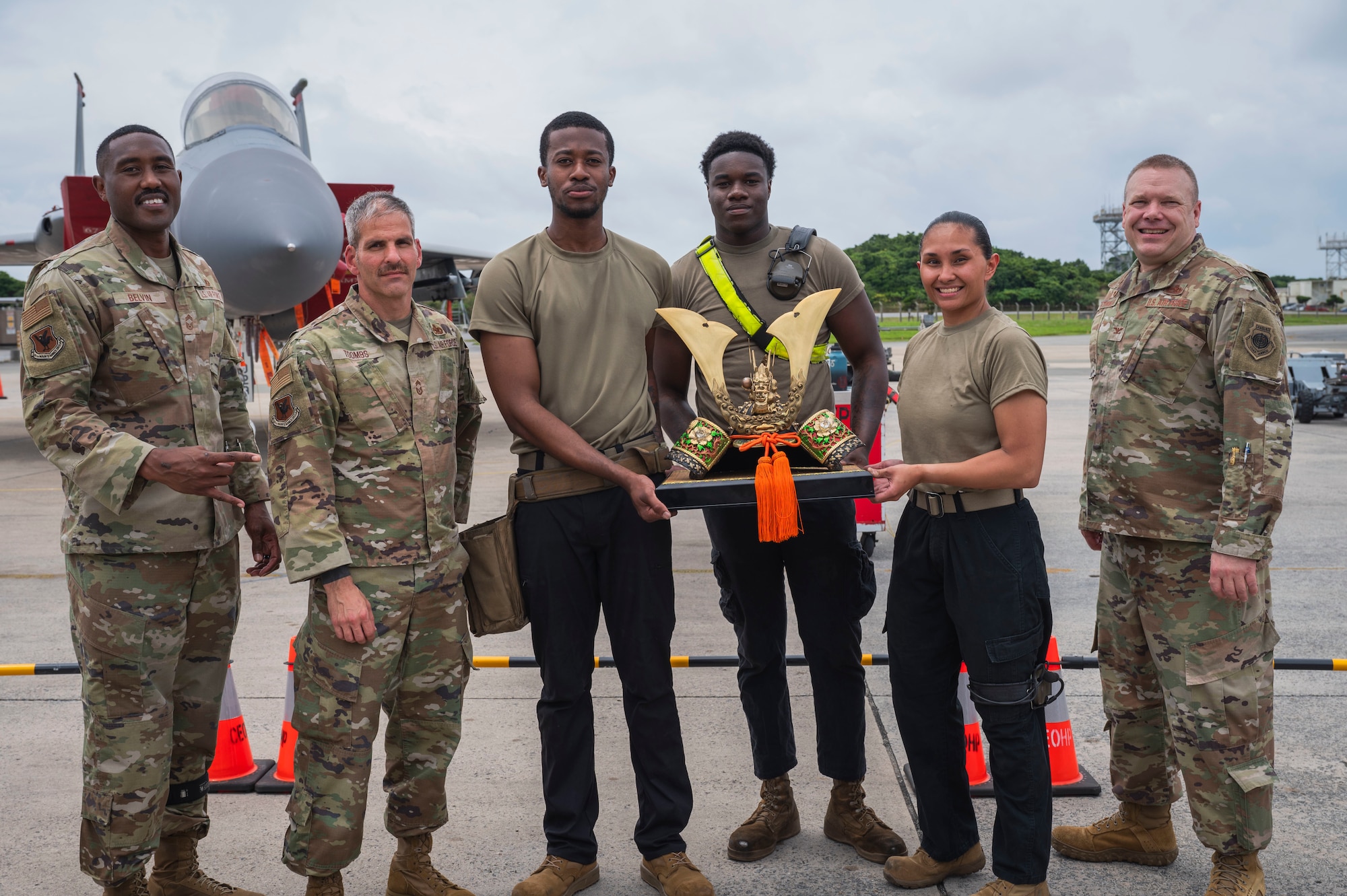 Airmen assigned to the 336th Fighter Generation Squadron pose with 18th Maintenance Group leadership