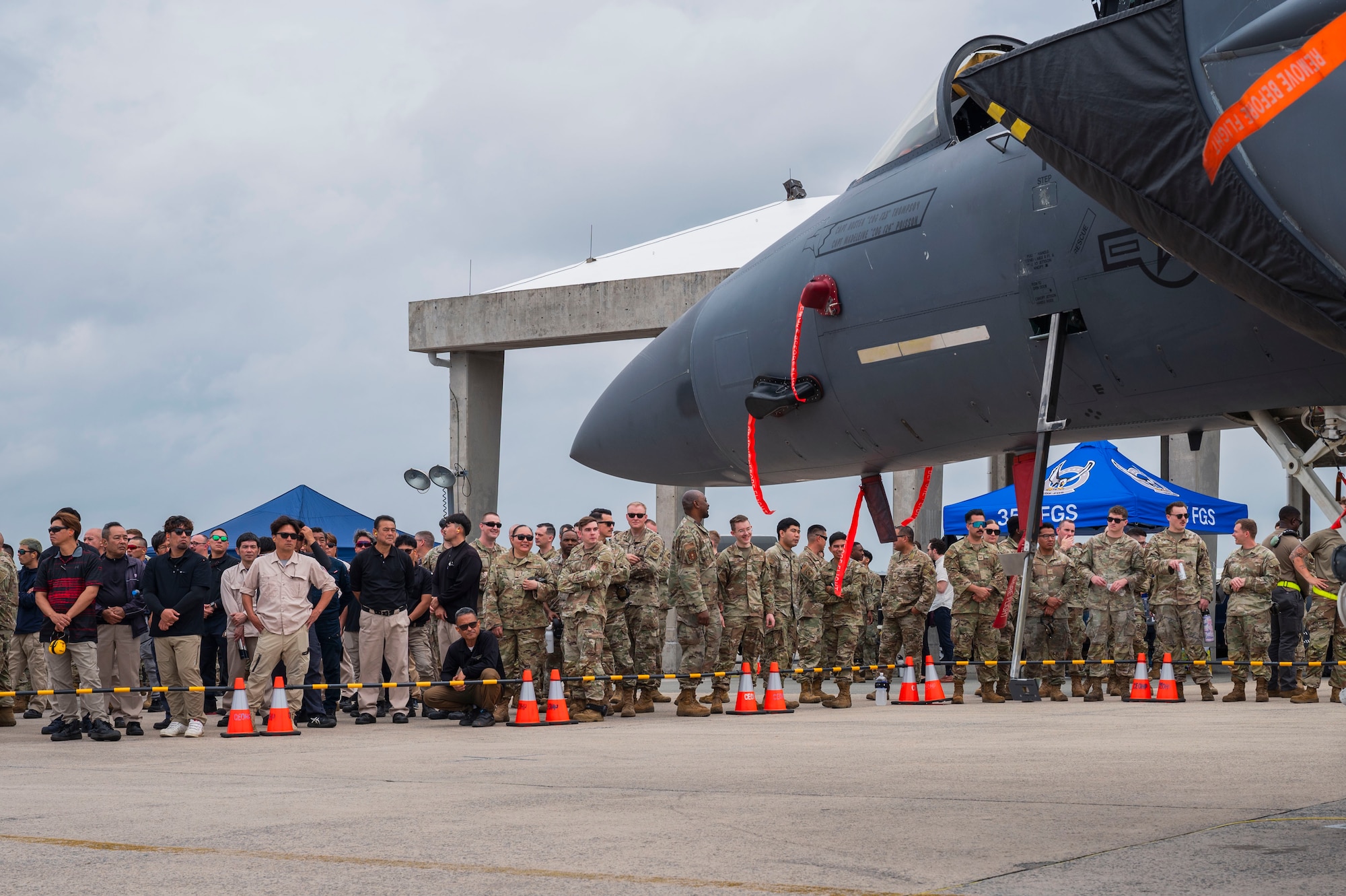 Members of the 18th Wing watch a quarterly load competition