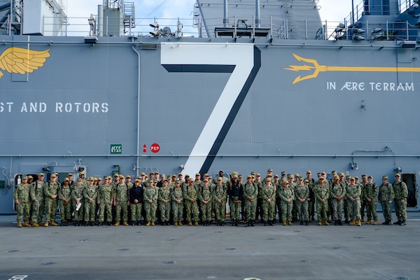 U.S. Navy Sailors assigned to Casualty Receiving Transport Ship 2 and CRTS-6 from Navy Medicine Readiness and Training Command San Diego pose for a photo aboard USS Tripoli (LHA 7) while conducting Amphibious Familiarization Training, May 7, 2025. Shipboard familiarization increases operational readiness within the Pacific Fleet and expedtionary medicine worldwide. The mission of NMCSD is to provide a superior experience for our patients, staff, and warfighters. NMCSD employs more than 5,000 active-duty military personnel, civilians, and contractors in southern California to deliver exceptional care afloat and ashore. (U.S. Navy photo by Mass Communication Specialist 2nd Class Jacob Woitzel)
