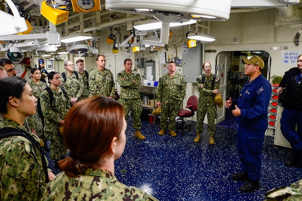 U.S. Navy Sailors assigned to Casualty Receiving Transport Ship 2 and CRTS-6 from Navy Medicine Readiness and Training Command San Diego learn about USS Tripoli's (LHA 7) medical capabilities while conducting Amphibious Familiarization Training, May 7, 2025. Shipboard familiarization increases operational readiness within the Pacific Fleet and expedtionary medicine worldwide. The mission of NMCSD is to provide a superior experience for our patients, staff, and warfighters. NMCSD employs more than 5,000 active-duty military personnel, civilians, and contractors in southern California to deliver exceptional care afloat and ashore. (U.S. Navy photo by Mass Communication Specialist 2nd Class Jacob Woitzel)